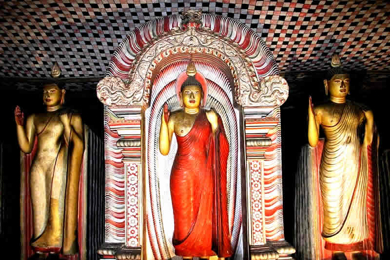 Standing Buddha at Dambulla cave temple,Visiting Sri Lanka Buddhist temples, Sri Lanka temple dress code, temple of the tooth dress code,