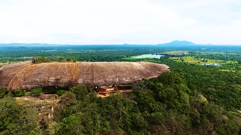 Visiting pidurangala cave temple on Sigiriya one day tour from Colombo